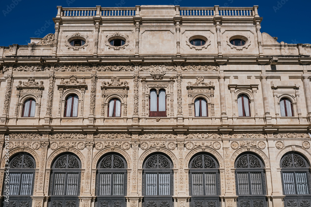 Seville City Hall building in Plaza of San Francisco on a summer day. Vertical photograph