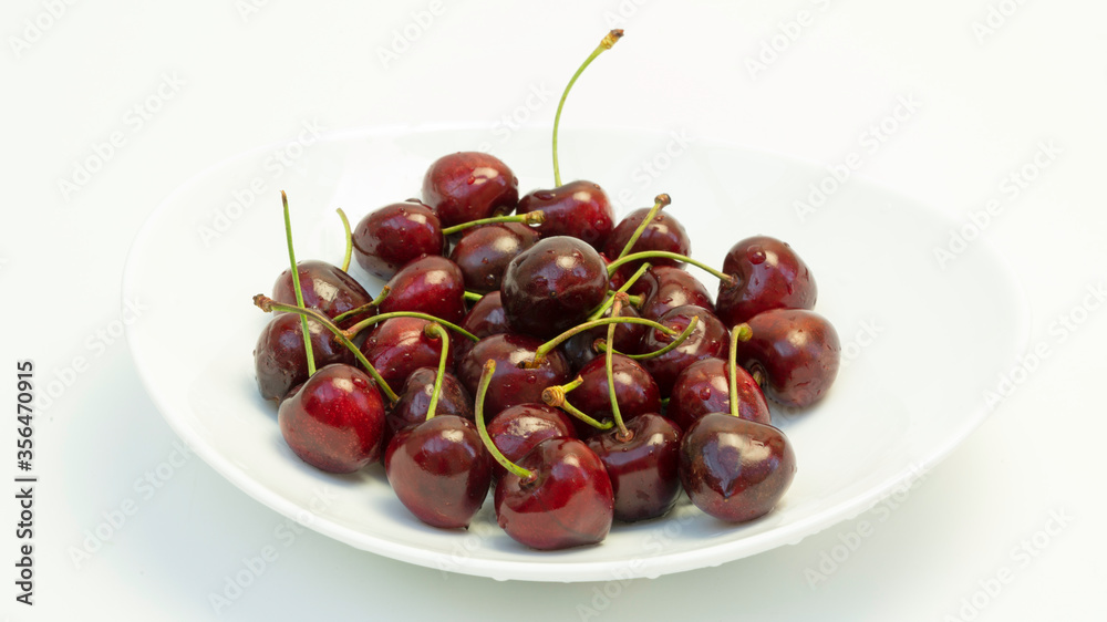 red cherries on white background red cherries on white background