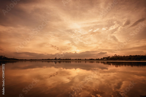 Fototapeta Naklejka Na Ścianę i Meble -  sunset with grass on the lake