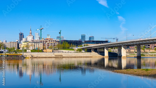 Panoramic view of Srodmiescie city center downtown quarter with Swietokrzyski Bridge - Most Swietokrzyski - over Vistula river in Warsaw  Poland