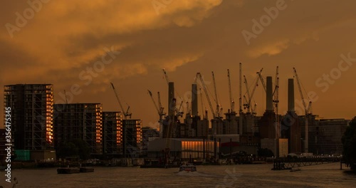 London Battersea Power Station And Thames River At Sunset - Time Lapse, Zoom Out photo
