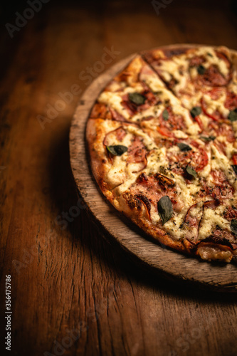 Delicious pizza in wood table