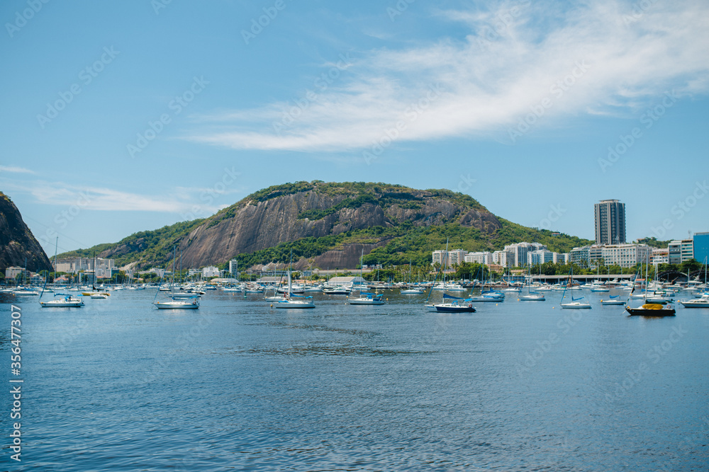 panoramic view of Rio de Janeiro and Mount, with many local yachts and boats . View from Flamengo Beach.