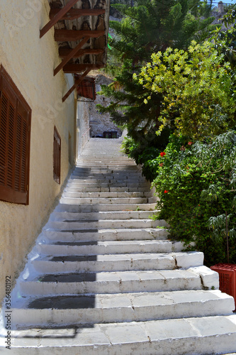 Stairs going up next to a house in historic old town of Nafplio, Greece.