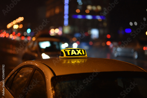 taxi sign on car in the night city