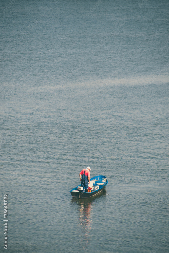 fisherman in a boat at Danube