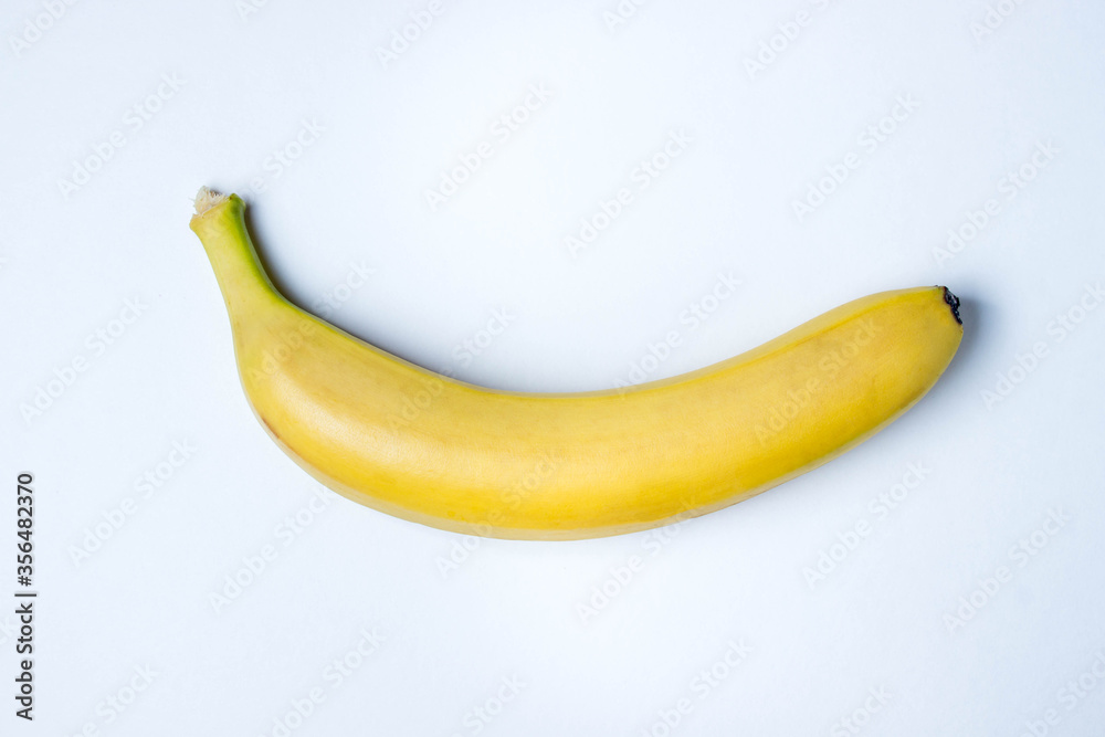 Banana on a white background. Photo from above. Banana as a background. Yellow beautiful banana Banana on a white background. Photo from above. Banana as a background. Yellow beautiful banana