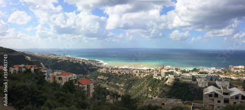 Large panoramic view of the mediterranean lebanese shore  near the mouth of the river called Nahr Ibrahim photo