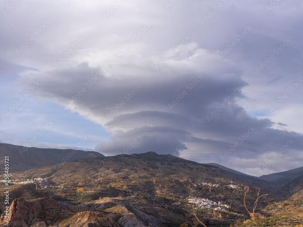 mountainous landscape and cloudy sky in the towns of Sierra Nevada (Spain)

