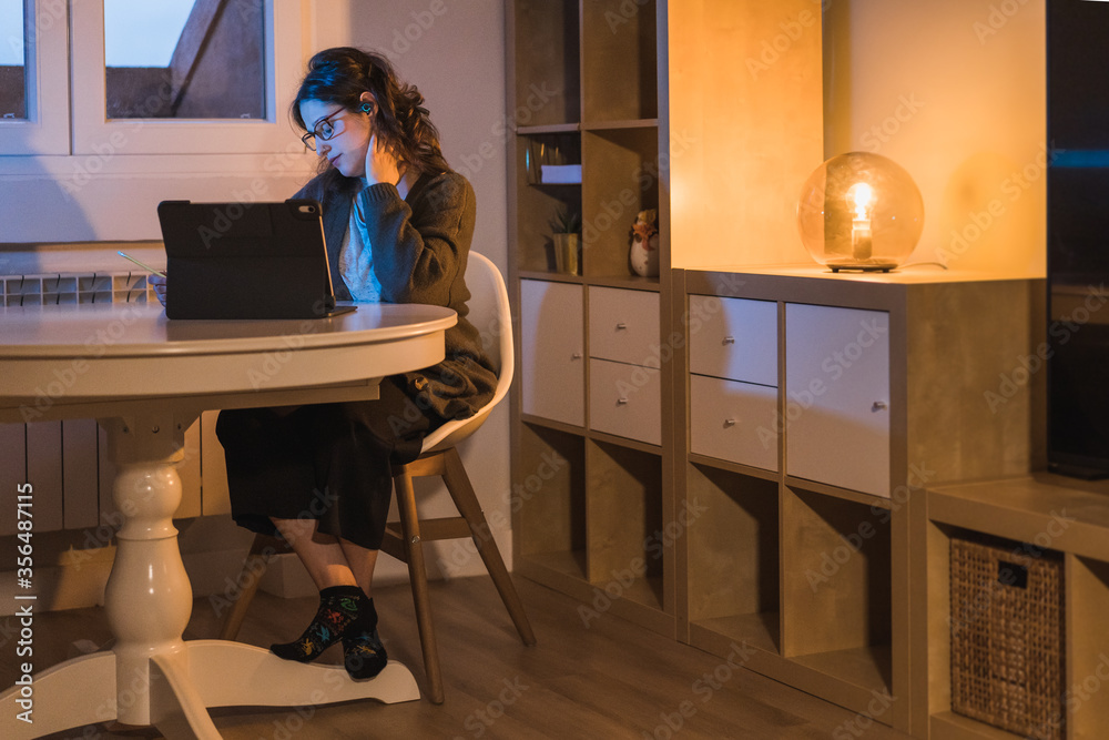 © Cavan Images - White Woman working from home