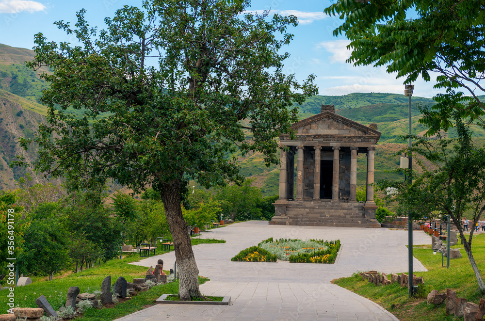 pagan ancient temple of Garni on a background of green mountains, a famous landmark of Armenia
