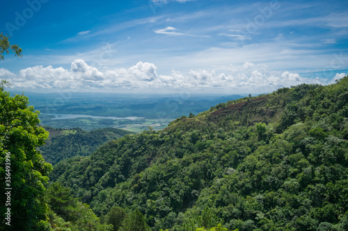 Majestic panorama of green mountains with clouds