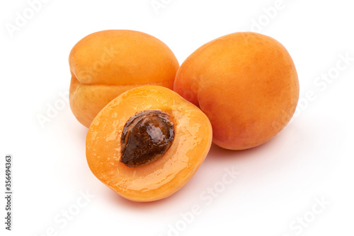 Sweet juicy yellow apricots, ripe nectarines, isolated on white background photo