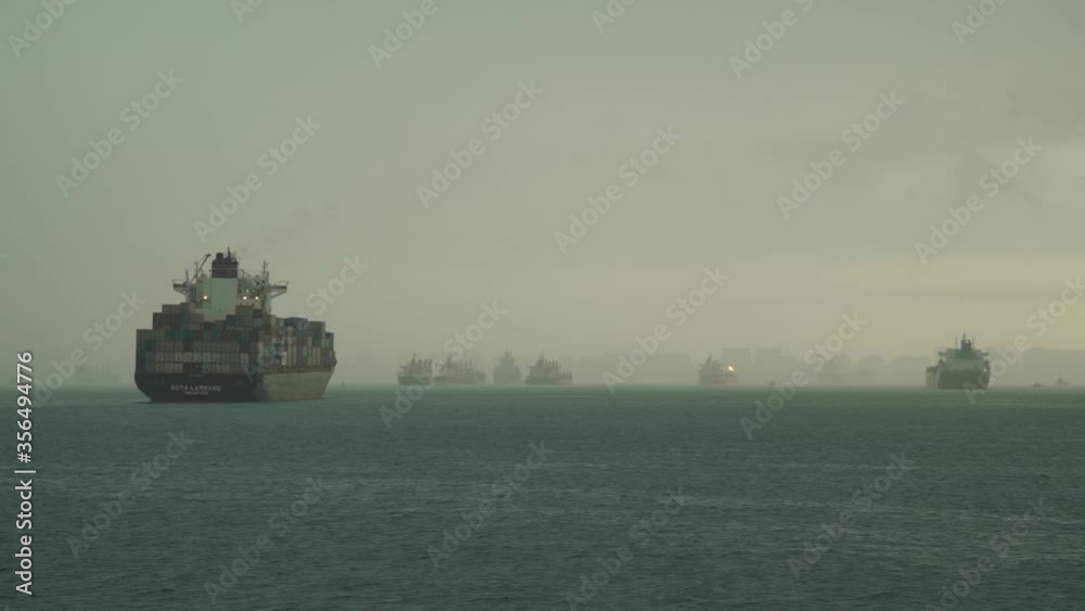 Ships are anchored in the port of Singapore. Ships stand by.
Hundreds of cargo ships anchored off the coast of Singapore. Ships are anchored in the port of Singapore. Ships stand by.
Hundreds of cargo ships anchored off the coast of Singapore.