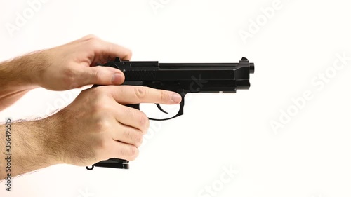 Man reloads gun and shot on white background