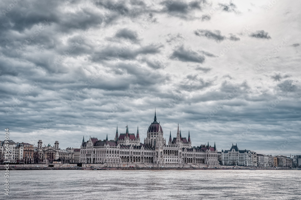 Fototapeta premium Hungarian Parliament facing Danube with clouds overhead in Budap