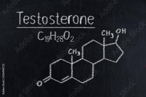 Black chalkboard with the chemical formula of testosterone