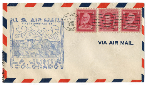 La Junta, Colorado, The USA  - 15 November 1940: US historical envelope: cover with cachet Air Mail First flight, red postage stamps, James Fenimore Cooper, John Greenleaf Whittier, two cents

