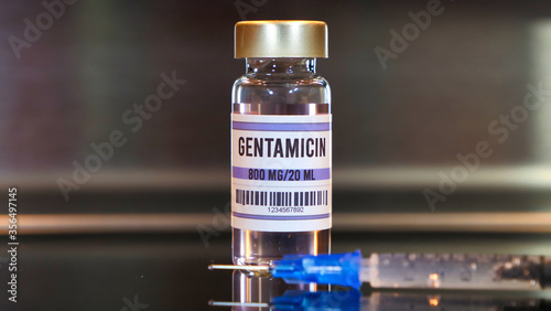 Gentamicin drug and syringe on black table