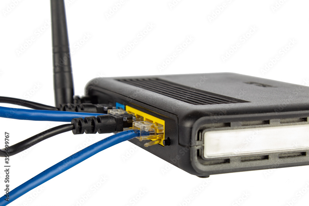 WI-FI router, back panel with connected wires. WI-FI router, back panel with connected wires.
