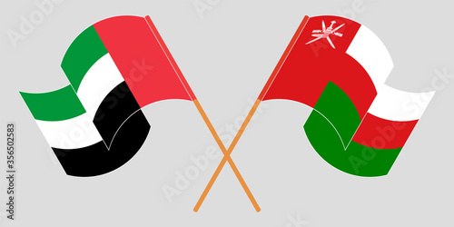 Crossed flags of Oman and the United Arab Emirates