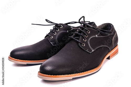 simple black men's shoes on a white background, unbranded and unlabeled