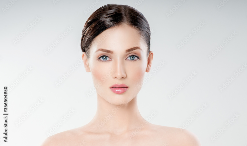 Beautiful face of young adult woman with clean fresh skin. Looking at Camera. Beautiful face of young adult woman with clean fresh skin. Looking at Camera.