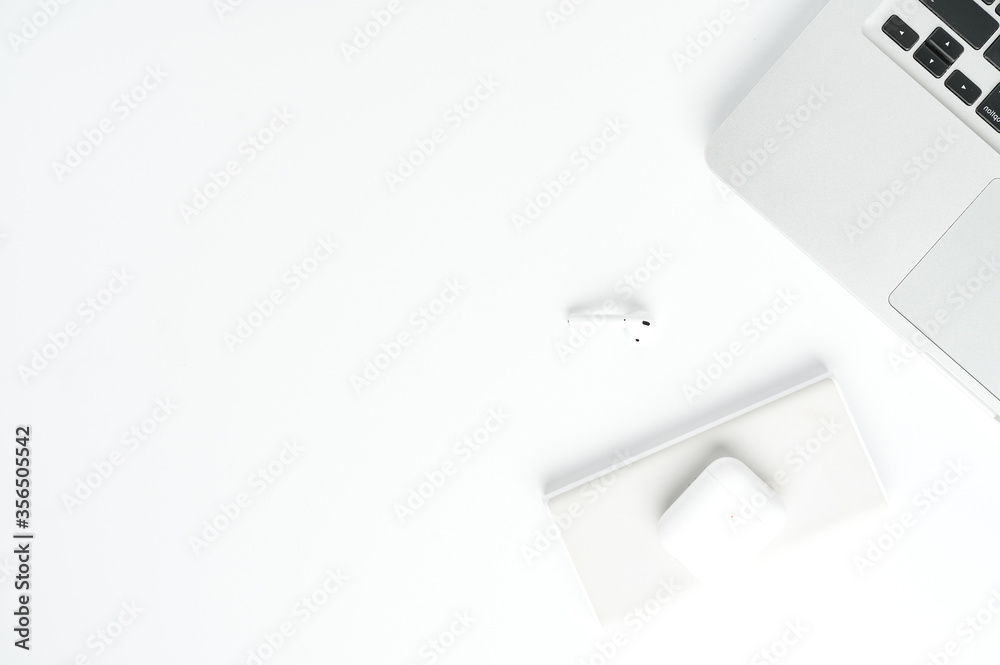 Mockup. Flatlay camera notebook and pods on white