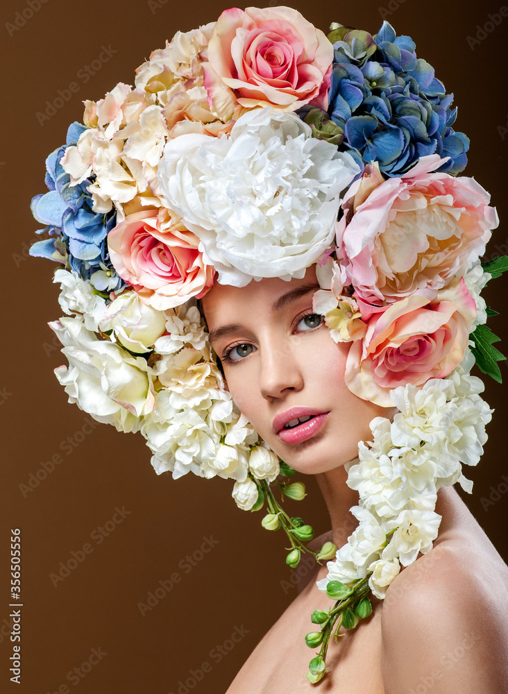Beautiful woman with flowers in her hair. Bouquet of Beautiful Flowers. Hairstyle with flowers. Nature Hairstyle. Stock Photo | Adobe Stock Beautiful woman with flowers in her hair. Bouquet of Beautiful Flowers. Hairstyle with flowers. Nature Hairstyle. Stock Photo | Adobe Stock