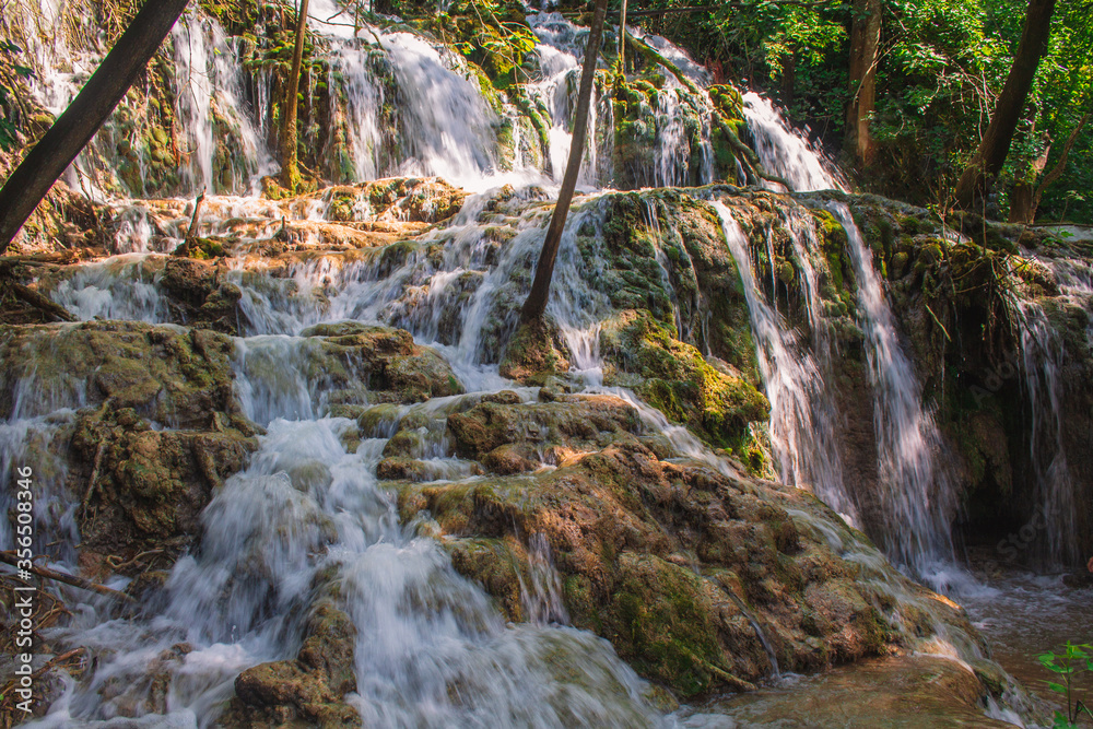 Krka National Park. Waterfall and wild landscape at famous tourist attraction in Croatia Krka National Park. Waterfall and wild landscape at famous tourist attraction in Croatia