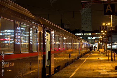 Train station in the night in Hamburg with train at the platform