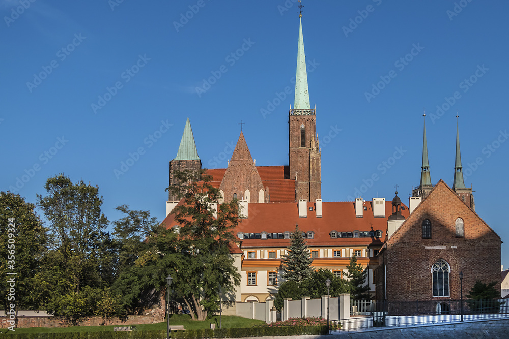 Obraz premium View of Collegiate Church of the Holy Cross and St. Bartholomew in Wrocław. Gothic church located in the Tumski Island (