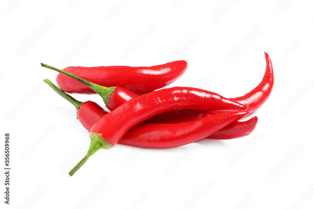 Ripe red hot chili peppers isolated on white Ripe red hot chili peppers isolated on white