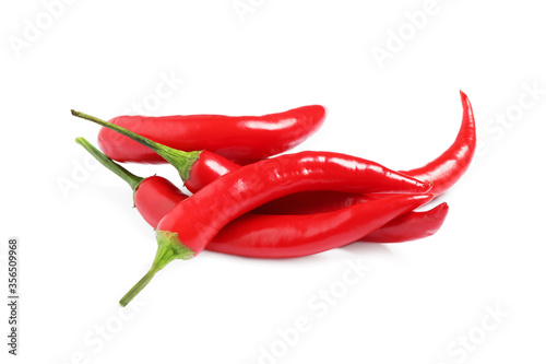 Ripe red hot chili peppers isolated on white