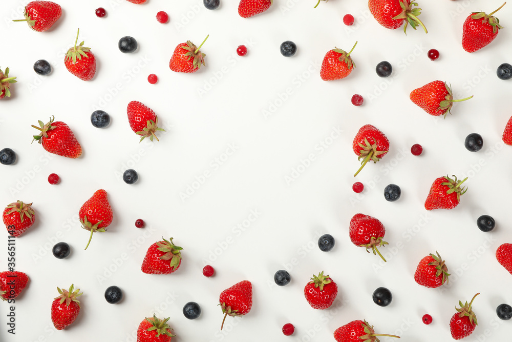 Flat lay with tasty strawberry and blueberry on white background, top view. Summer berry Flat lay with tasty strawberry and blueberry on white background, top view. Summer berry