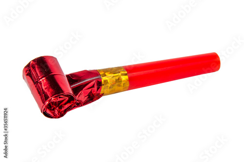 Tableau sur toile Party red foil whistle or noise maker horn rolled isolated on the white