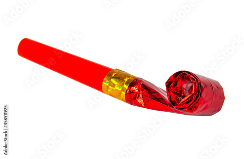 Party red foil whistle or noise maker horn rolled isolated on the white photo