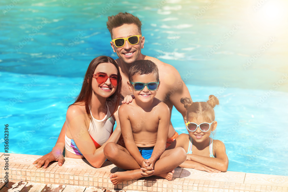 Fototapeta premium Happy family in swimming pool on sunny day