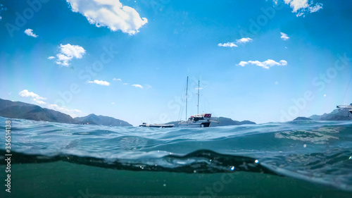 Obraz na plátne Underwater photo of beautiful yacht floating in the sea