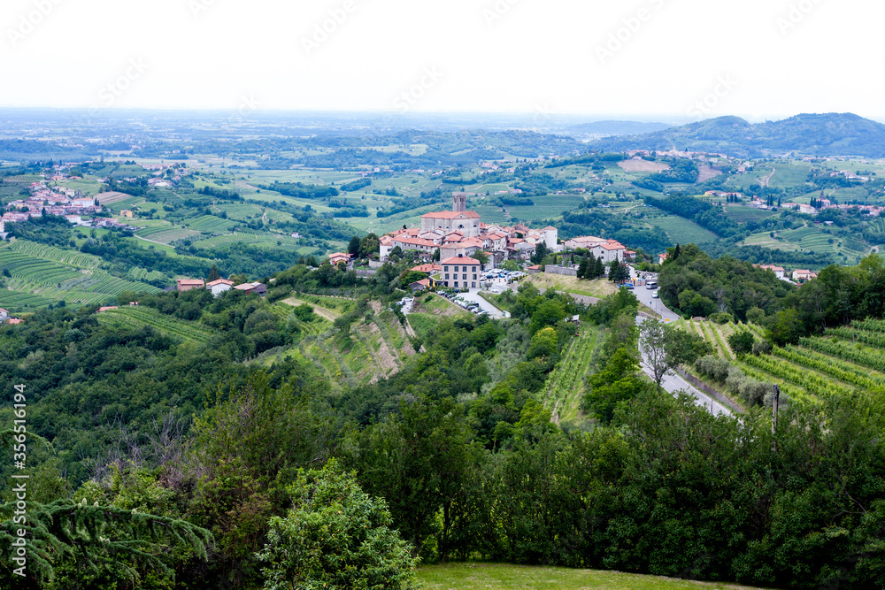 The view from the heights of the mountains, fields, and vineyards of the Italian foothills of the Alps