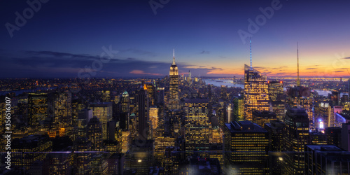 Wallpaper Mural Wide angle drone view of illuminated skyscrapers located in downtown of modern city against cloudy sundown sky Torontodigital.ca