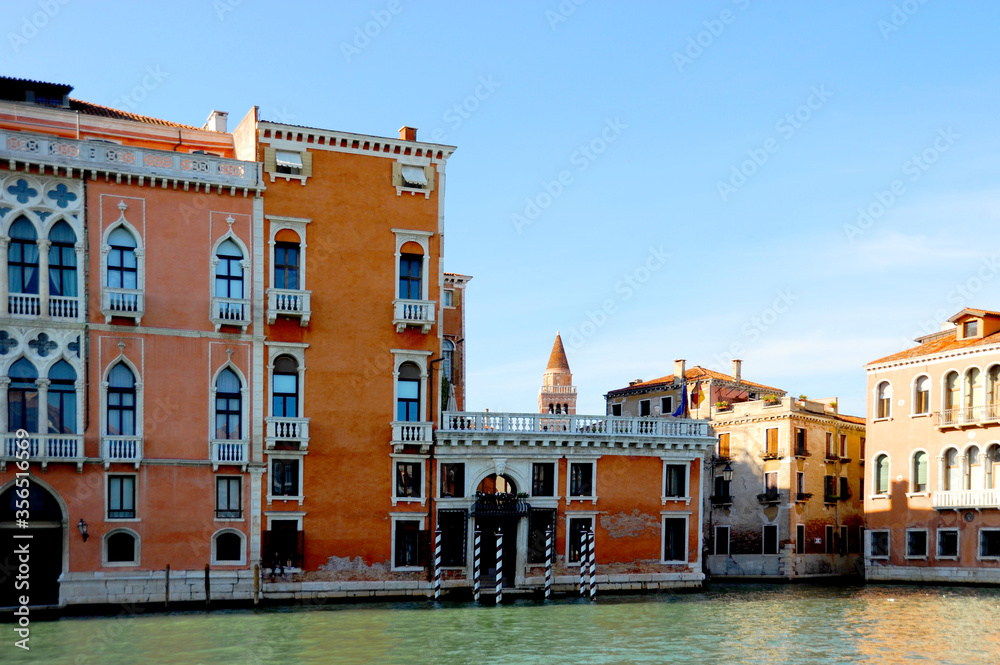 On the Grand Canal in Venice with Venetian architecture, style, and culture all around.  