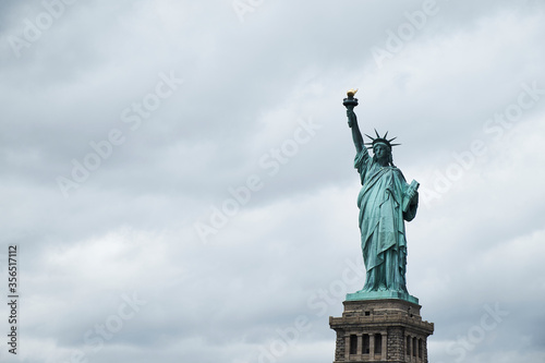 Statue of Liberty against cloudy sky