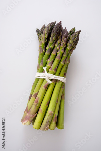Heap of fresh asparagus isolated. Fresh vegetables. Top view.