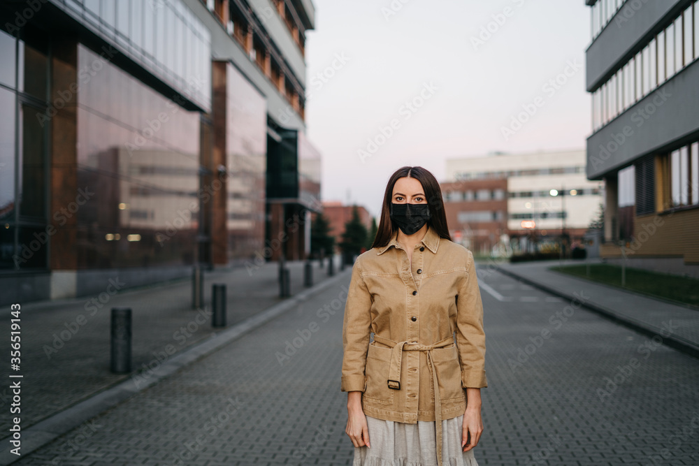 Fototapeta premium young woman in a protective mask