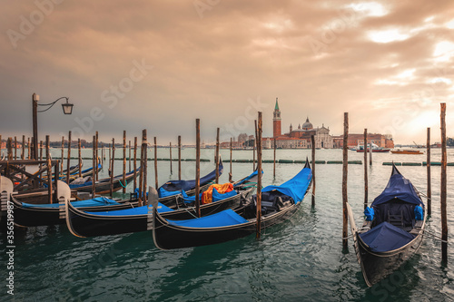 Famous Venetian gondolas in canal. Gondola is hallmark of Venice, Italy. © Visual Intermezzo