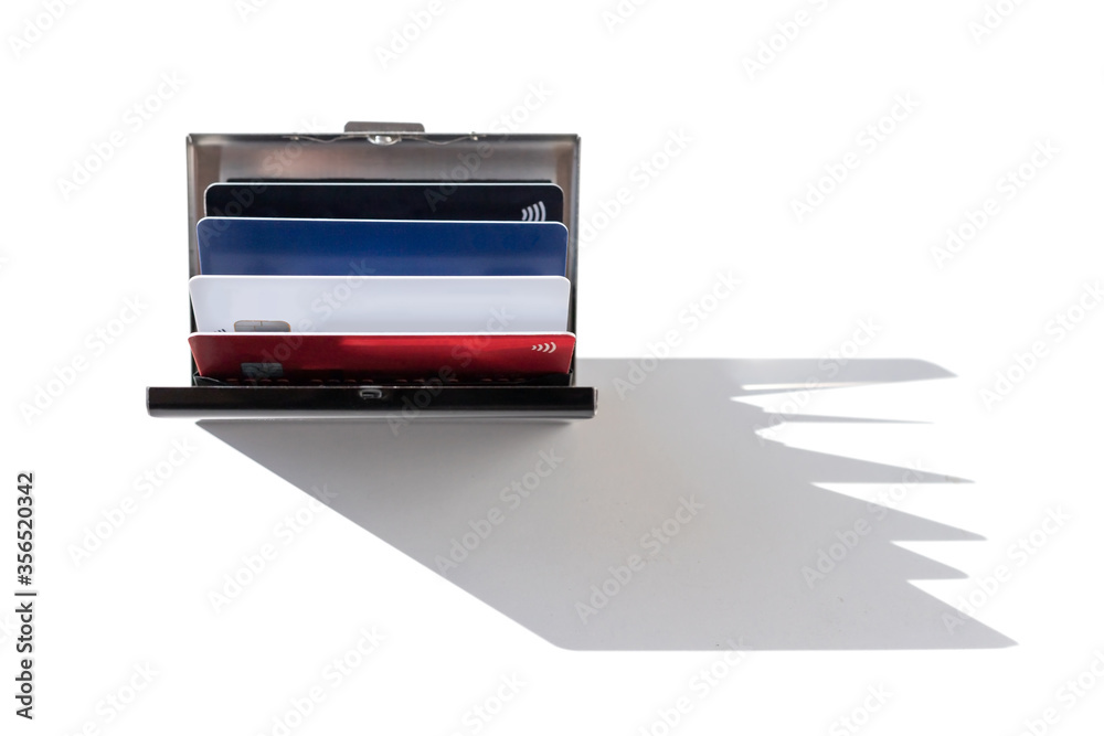 Stainless steel business ID credit card holder with credit cards, daylight and sharp shadow Stainless steel business ID credit card holder with credit cards, daylight and sharp shadow