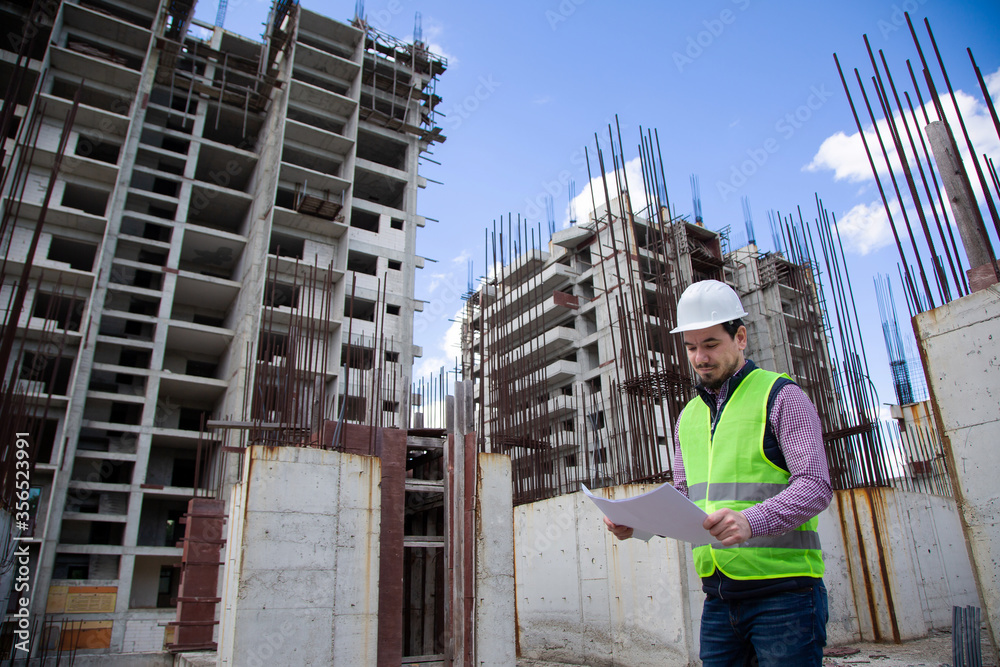 Engineer Checks the Technical Specifications on Sitec Engineer Checks the Technical Specifications on Sitec