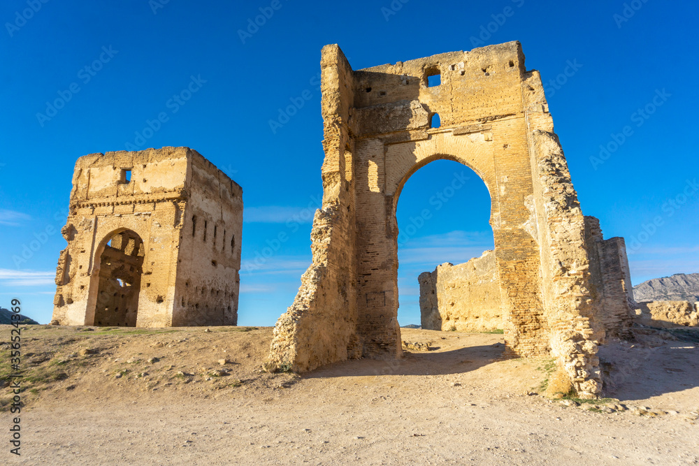 Ancient Marinid tombs and mausoleum ruins in Meknes, Morocco during various times of day.