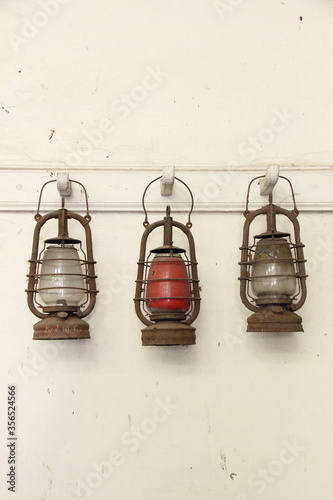 three oil lamps